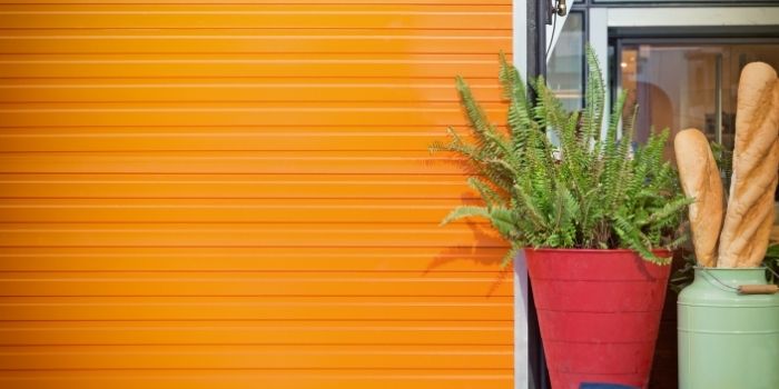 Orange colored wall with red and green